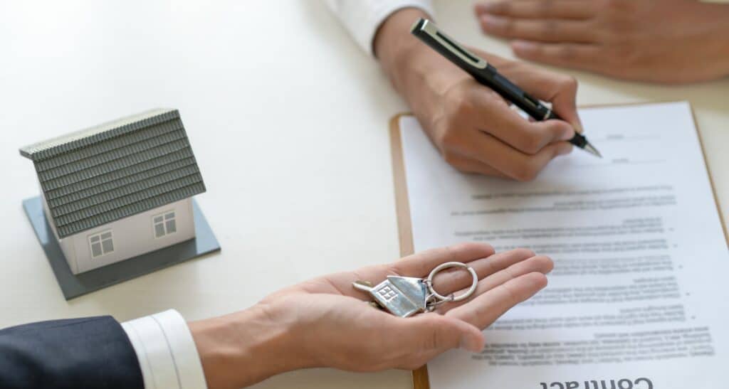 Signing a loan for a home purchase.