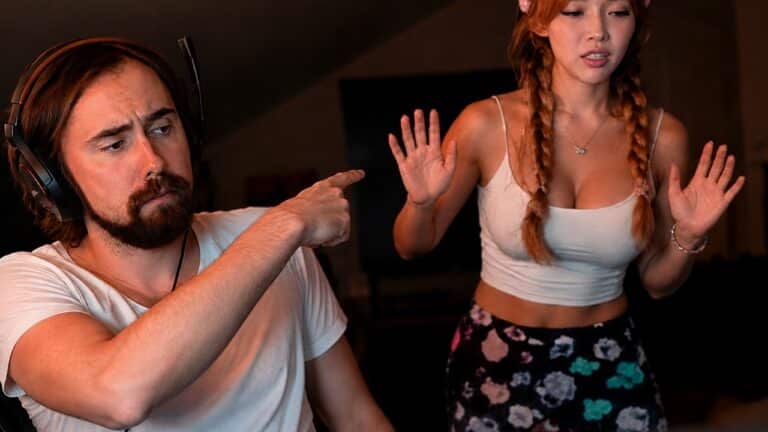 Asmongold pointing toward Kaise with smooth, fuller-looking hair in a recent video
