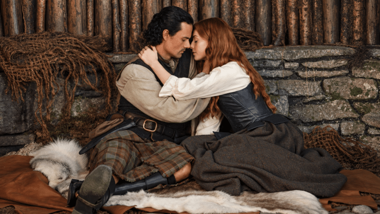 Brian Fraser and Ellen MacKenzie embrace in Outlander: Blood of My Blood