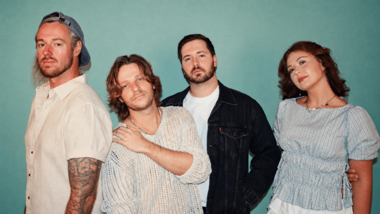 The four members of Lucid Safari posed against a pale green wall