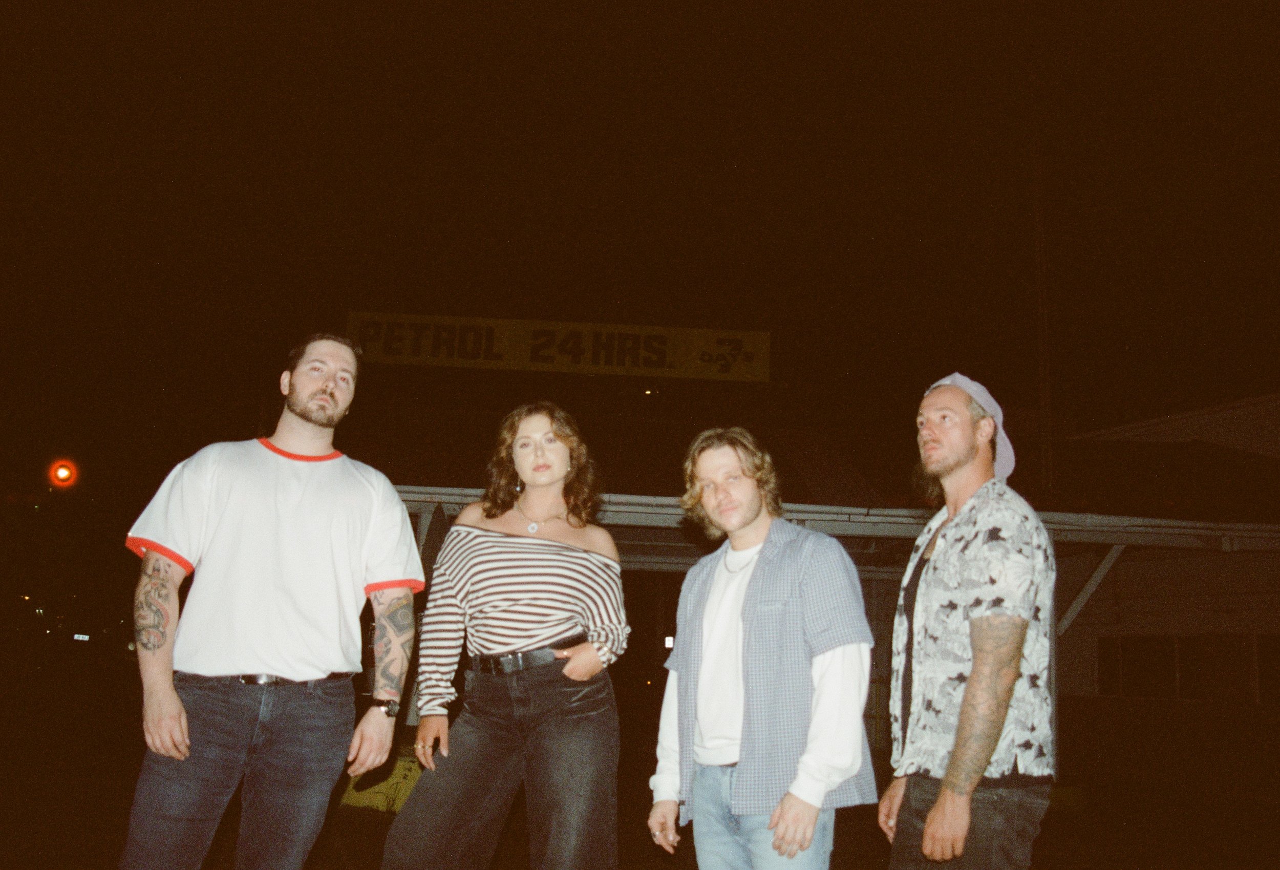 Lucid Safari posing together outdoors at night