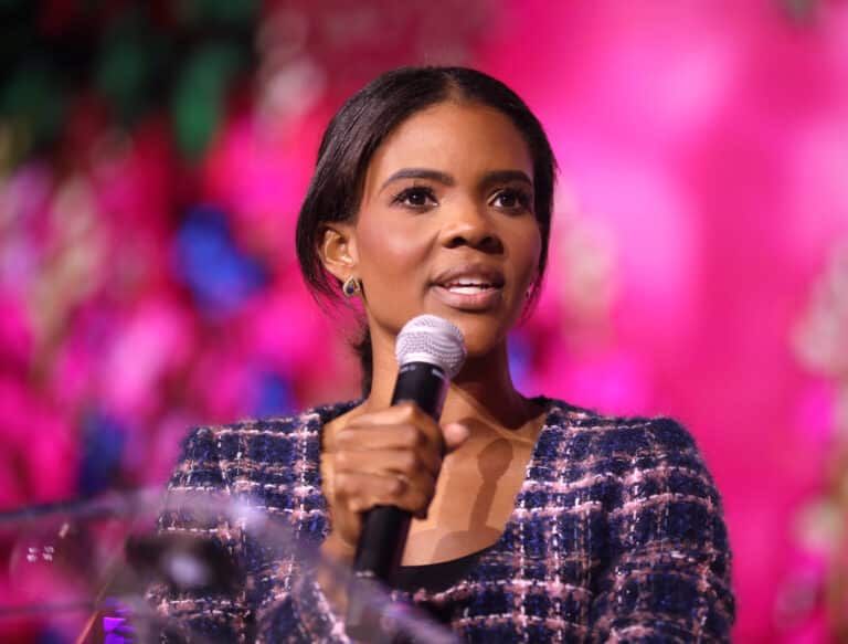 Candace Owens speaking into a microphone at the 2024 Young Women's Leadership Summit