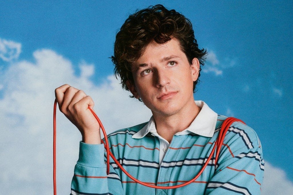 Charlie Puth in a blue-sky promotional portrait for his 2026 tour