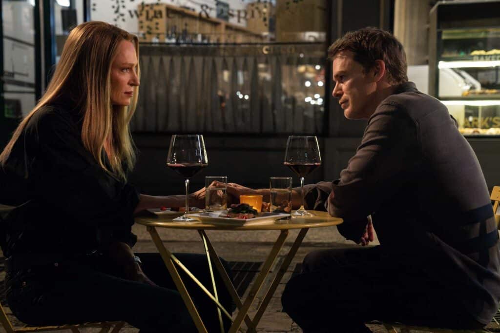 Uma Thurman as Charley and Michael C. Hall as Dexter seated at a restaurant table