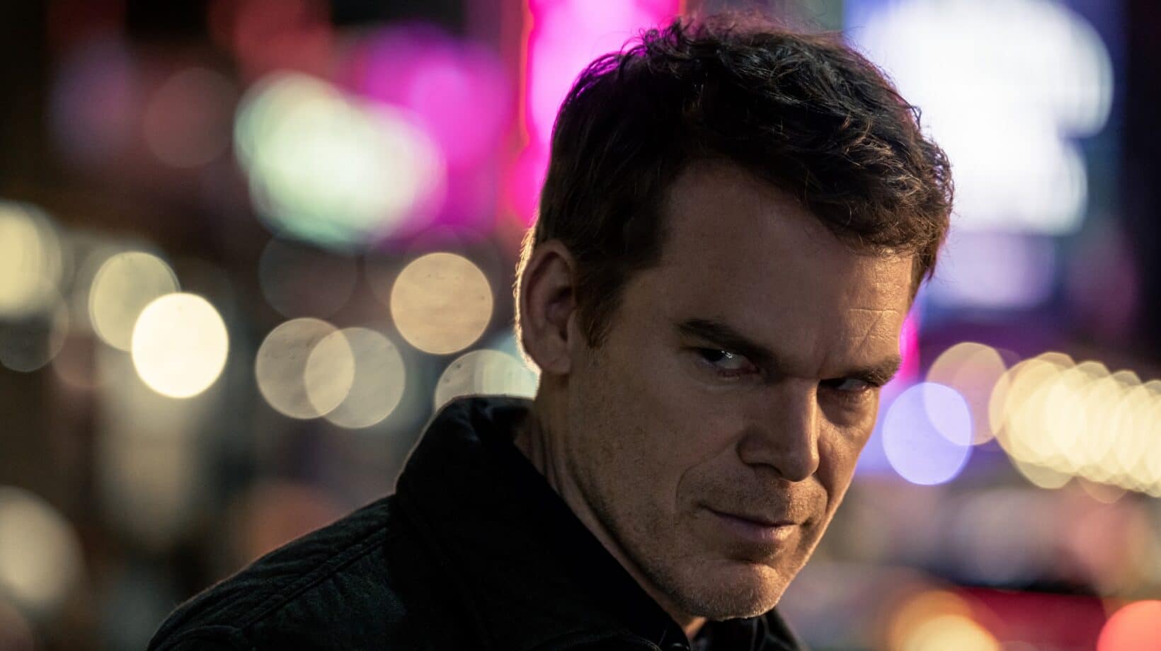 Michael C. Hall as Dexter Morgan against blurred New York lights
