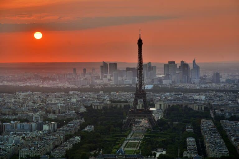 The Eiffel Tower rising over the Paris skyline at sunset