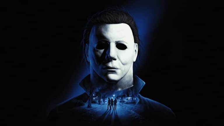 Michael Myers stands in a dark Haddonfield street in Halloween: The Game
