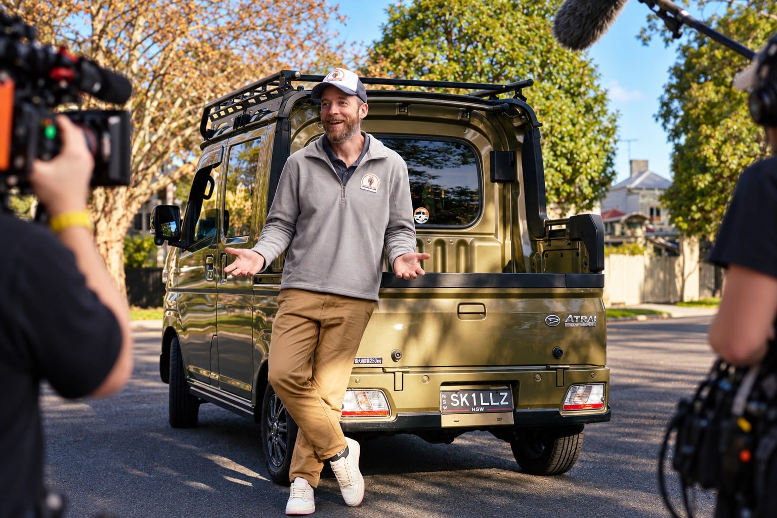 Hamish Blake beside the Unskilled Adult work truck during filming