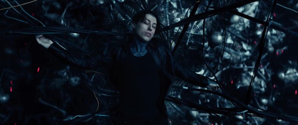 Ronnie Radke suspended amid cables and monstrous forms in the Joseph music video