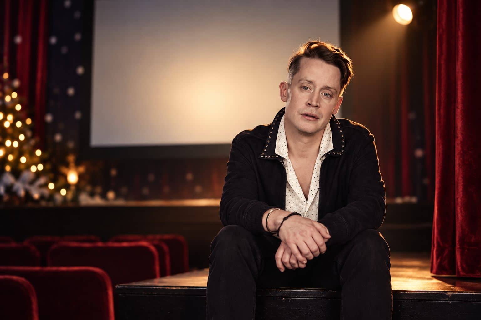 Macaulay Culkin seated in an Australian theatre ahead of his Home Alone screening tour