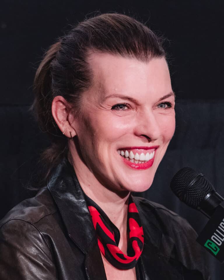 Milla Jovovich smiling during a Protector question and answer event in 2026