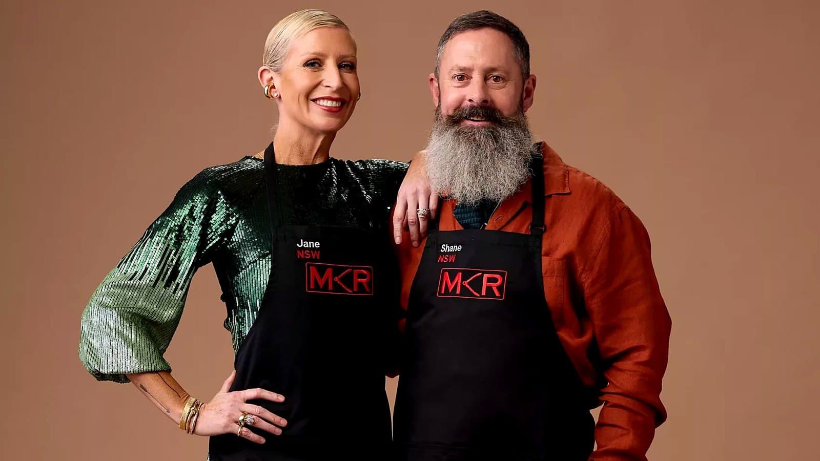 MKR 2026 contestants Jane and Shane standing together in black aprons