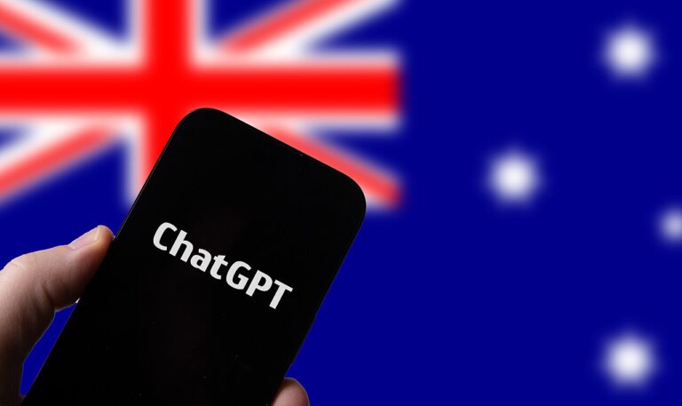 Hand holding a phone displaying ChatGPT in front of an Australian flag