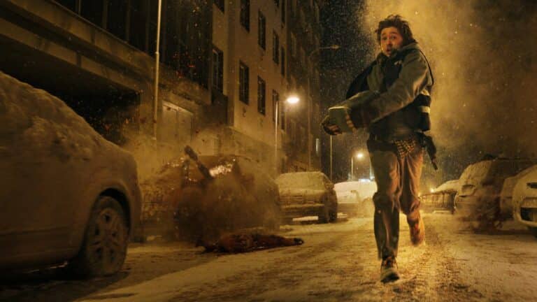 Austin Abrams as Bryan runs down a snowy street in the 2026 Resident Evil film