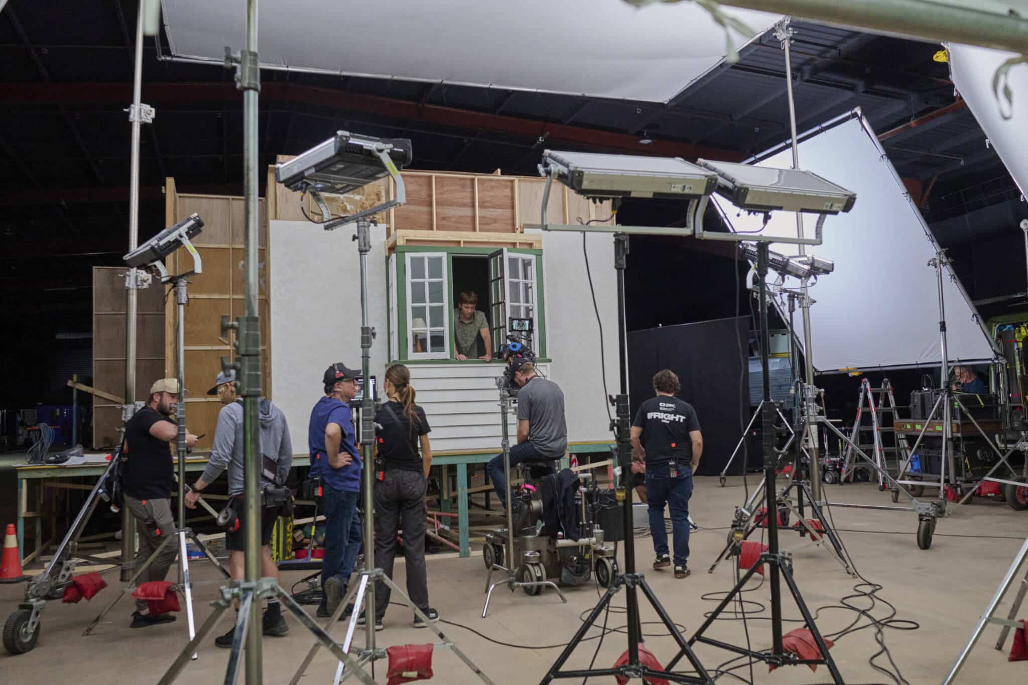 Crew members working around a film set at Screen Queensland Studios