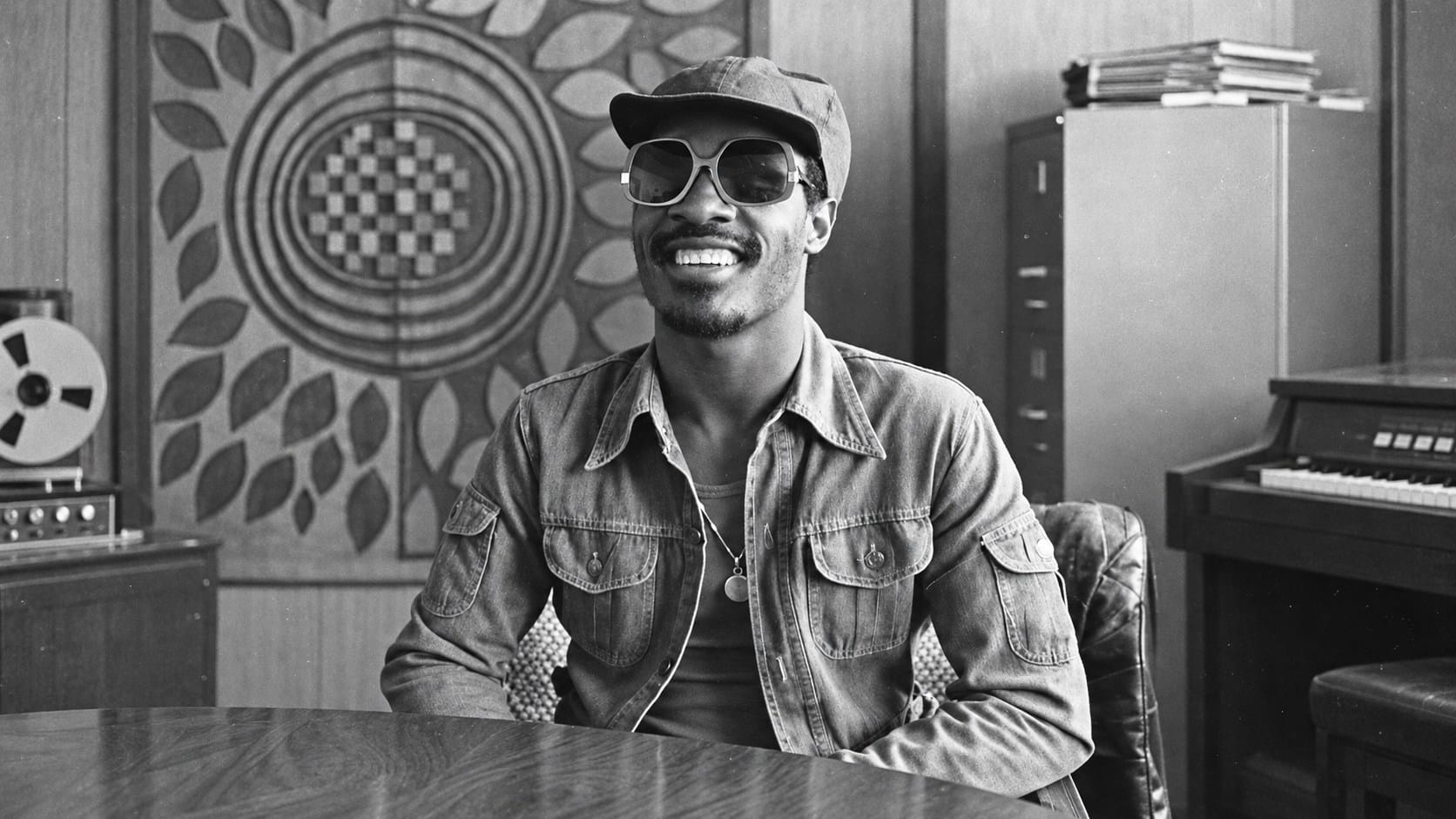 Stevie Wonder smiling in a recording studio in 1975
