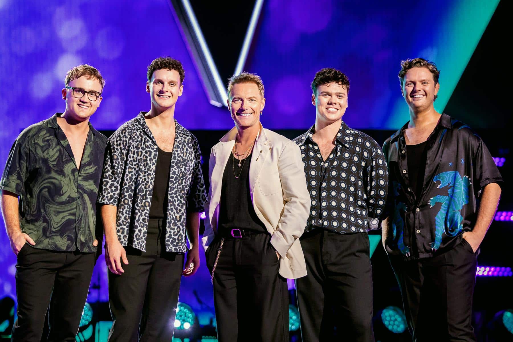 The 60Four standing with Ronan Keating on The Voice Australia stage