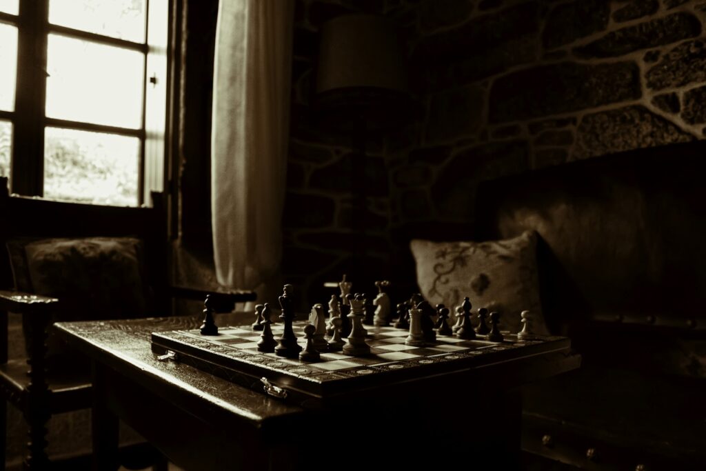 A chessboard set beside a window, used as an illustrative image for strategy in The Traitors Australia