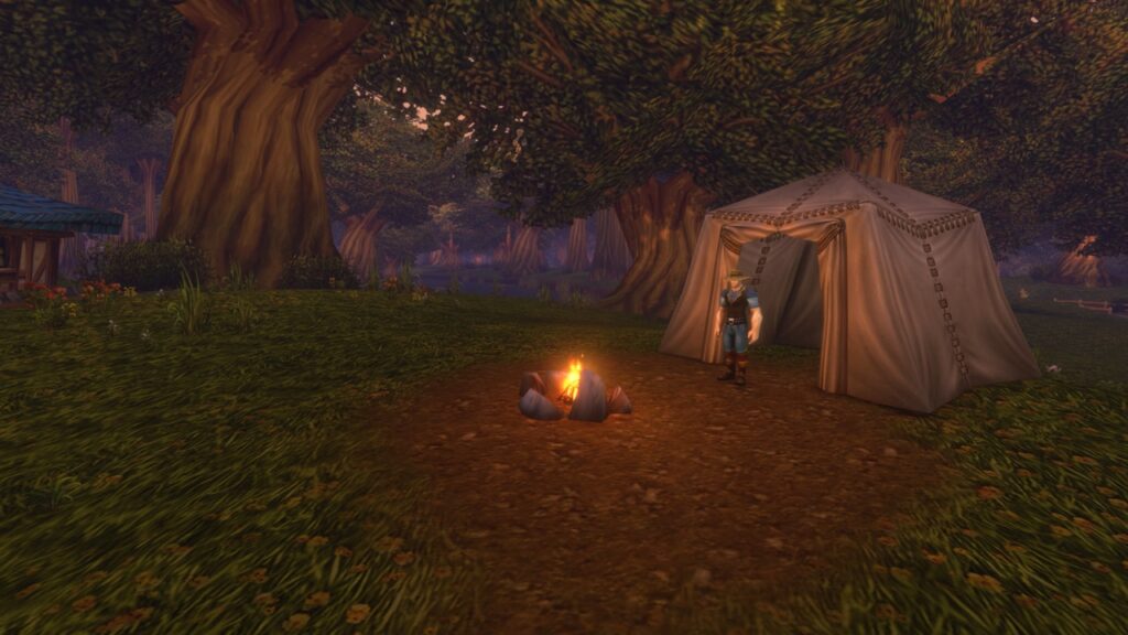 A tent and campfire in a forest campsite in World of Warcraft: Forever
