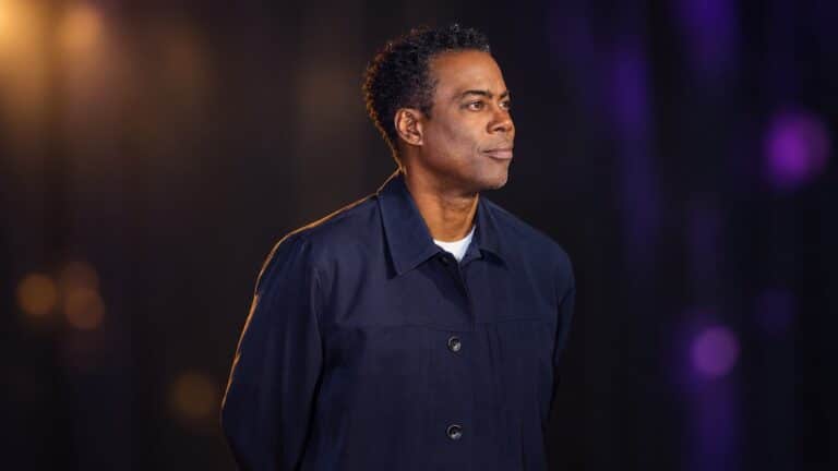 Chris Rock in a dark theatre portrait