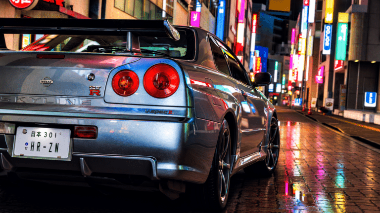 Silver Nissan Skyline GT-R on a neon-lit Tokyo street in Forza Horizon 6