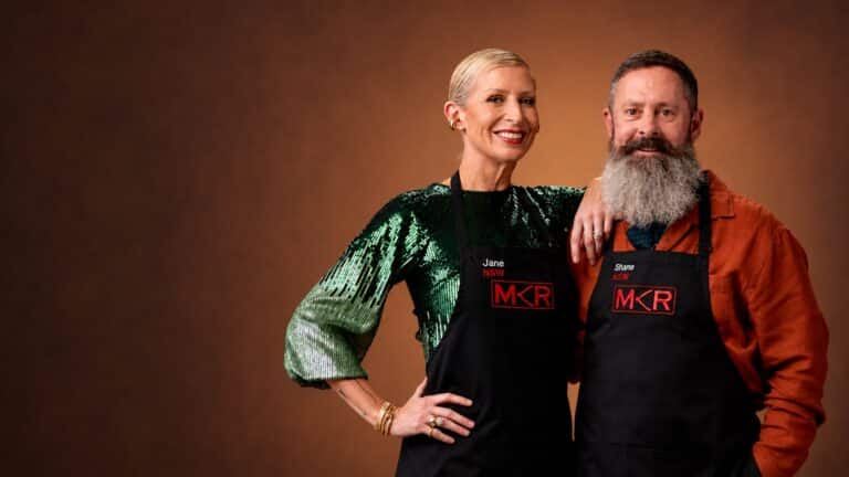 Jane and Shane from MKR smiling together in a warm studio publicity portrait