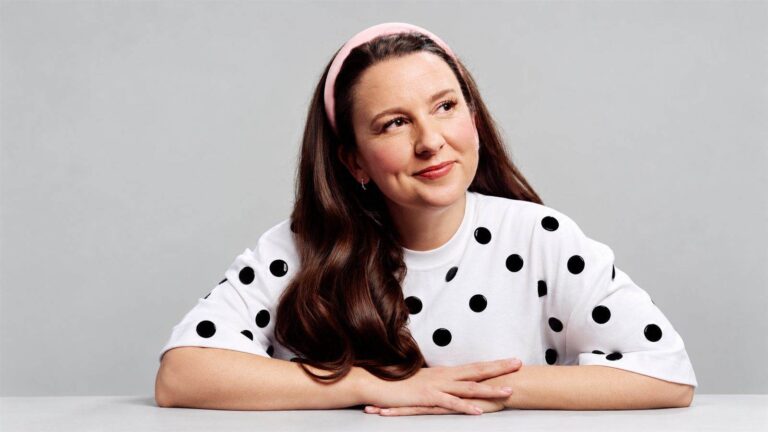 Ms Rachel in a thoughtful studio portrait