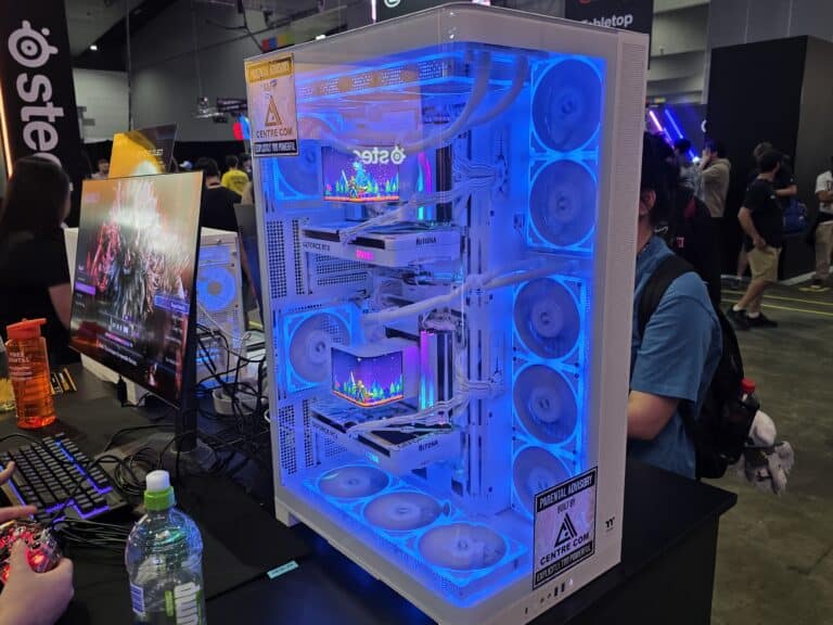 A white illuminated PC display with RiTONA graphics cards on Centre Com's PAX Aus stand