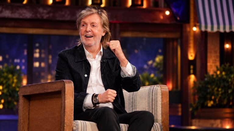 Paul McCartney smiles during a late-night television interview