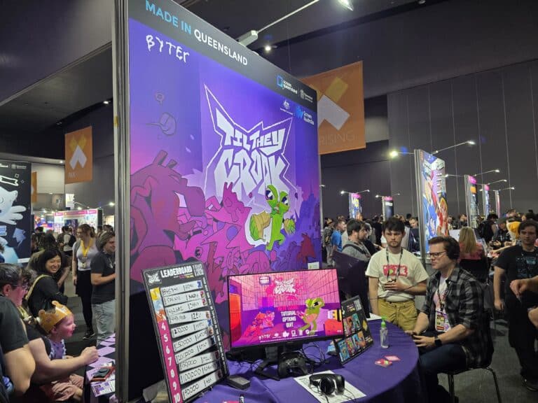 Players at BYTEr's TIL THEY CROAK booth beneath Made in Queensland signage at PAX Aus 2026
